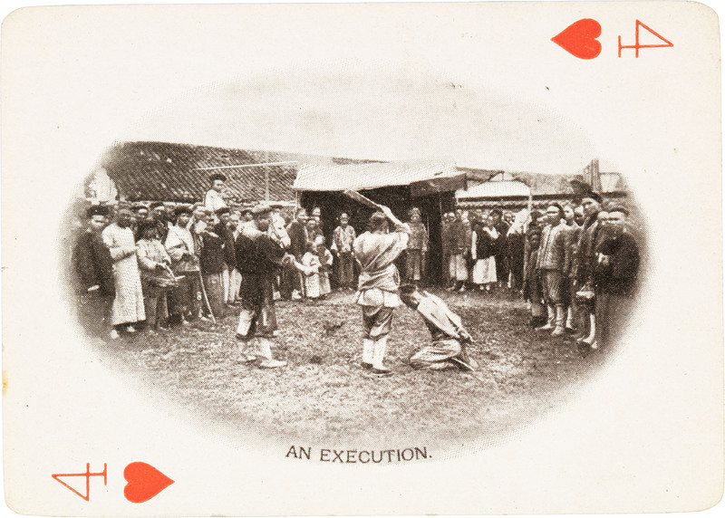 The 4 of hearts with a picture of a group of men surrounding two men in the middle of executing someone